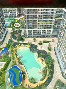 an aerial view of a resort with a swimming pool at Honey Vinhomes in Long Bình