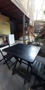 a ping pong table in the middle of a room at MOROOKA - chalés com jacuzzi in Alter do Chao +23 photos