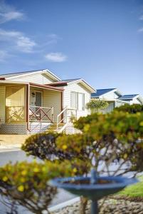 a house with a porch in front of it at Wavecrest Village & Tourist Park WA in Hopetoun