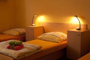 Postel nebo postele na pokoji v ubytování Apartmány REKO Kadaň