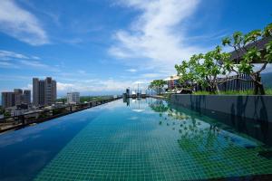 a swimming pool on the roof of a building at 留亦晚 in Toucheng