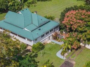 an overhead view of a building with a blue roof at Fig Tree House in Teven