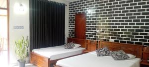 Postel nebo postele na pokoji v ubytování Ella Rawana Resort