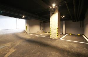 an empty parking garage with a brick pillar in it at Gwangalli Brown Dot Gwangalli Beach, Busan in Kwangan-dong