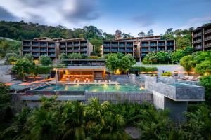 a view of a resort with a swimming pool at Sunsuri Phuket - SHA Plus in Nai Harn Beach