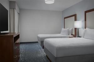 Homewood Suites by Hilton Newark-Cranford客房内的一张或多张床位