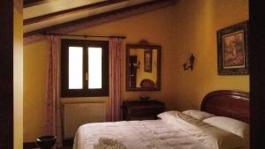Ένα ή περισσότερα κρεβάτια σε δωμάτιο στο Casa Rural Maidanea