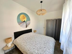 Katil atau katil-katil dalam bilik di Appartement avec place de Parking à deux pas de la plage
