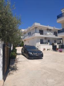 a black car parked in front of a building at Villa Zeka Ksamil in Ksamil