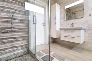 a bathroom with a shower and a sink at Luxusný rodinný dom v Trenčíne in Trenčín +6 photos