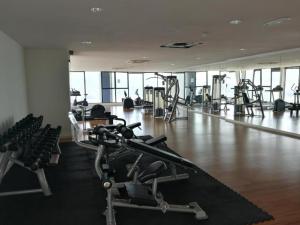 a gym with several treadmills and exercise bikes at Ryokan AI Japan Friend - Free Hotsprings & Massage in Kuala Lumpur