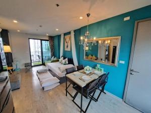 a living room with a couch and a table at Sea View 2 Bed Room Rare Find Great Location in Pattaya Central