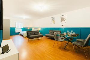 a living room with a couch and a table at Garibaldi Accommodation in Viterbo