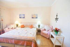 A bed or beds in a room at St.George's Bay Country Club & Spa