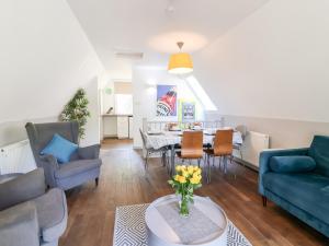 a living room with a couch and a table at Valley Lodge 37 in Callington