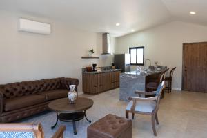 a living room with a couch and a table at Baja Toscana in Valle de Guadalupe