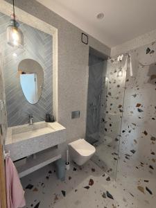 a bathroom with a toilet and a sink and a shower at lovNatura in Staniszów +36 photos