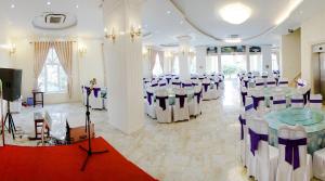 a banquet hall with tables and chairs in a room at Thuan Thanh Hotel in Ninh Binh