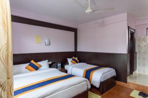 Ένα ή περισσότερα κρεβάτια σε δωμάτιο στο Hotel Monalisa Chitwan