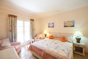A bed or beds in a room at St.George's Bay Country Club & Spa
