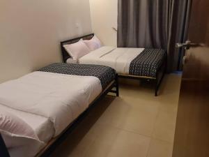 Postel nebo postele na pokoji v ubytování Spring Hills Apartment in Kampala