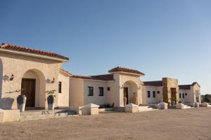 a row of houses in a parking lot at Villas Baja Toscana de Rancho Olivares in Ensenada
