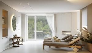 a living room with a couch and a table at Villa & Hotel Am Park in Reichenbach im Vogtland