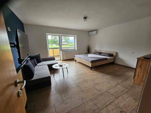 Postel nebo postele na pokoji v ubytování Grmač Apartments