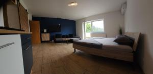 Postel nebo postele na pokoji v ubytování Grmač Apartments