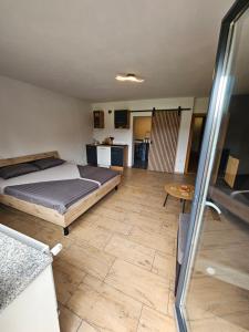 Postel nebo postele na pokoji v ubytování Grmač Apartments