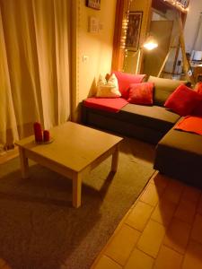 a living room with a couch and a coffee table at evvIVA's house in Osimo