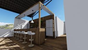 a bar on the deck of a building with stools at AURA Lounge in Udawalawe