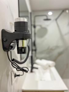 a camera on the wall of a bathroom at Boutique Palacio Centro in Alicante +28 photos