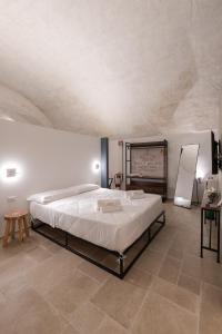 Giường trong phòng chung tại La Goccia Suite