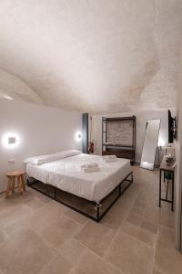 Giường trong phòng chung tại La Goccia Suite