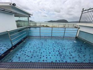 a swimming pool on the side of a building at Simfoni Comfy Premium 03 in Langkawi Islands