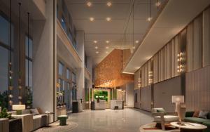 a lobby of a building with chairs and tables at EVEN Hotel Shanghai Jinqiao by IHG in Shanghai