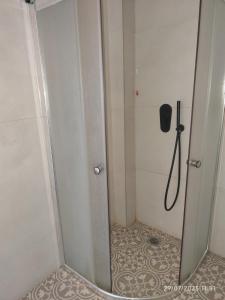 a shower with a glass door in a bathroom at 193 Urban Patras in Patra