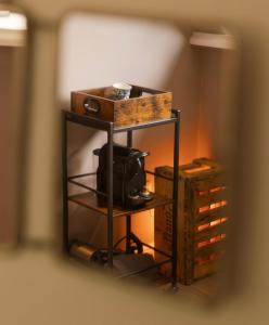 a small shelf with a box on top of it at Nest - luxe wellness met privé sauna in Friesland in Luxwoude +97 photos
