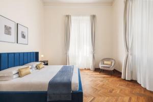 Ένα ή περισσότερα κρεβάτια σε δωμάτιο στο Modena Boutique Apartment