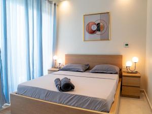Katil atau katil-katil dalam bilik di Appartement Ngor Almadie +5 gambar
