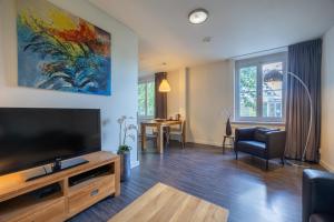 TV a/nebo společenská místnost v ubytování Amrâth Hotel Media Park Hilversum