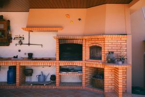 a model of a kitchen with a brick oven at Casa de Luzes in Amarante