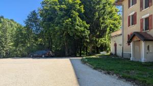 a car parked in a driveway next to a building at Château Foncine in Foncine-le-Bas +6 photos