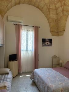 Ένα ή περισσότερα κρεβάτια σε δωμάτιο στο Casa Terrazzata in centro