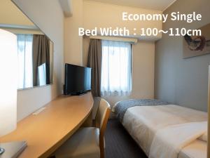 Postel nebo postele na pokoji v ubytování Hotel Binario Umeda