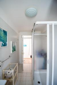 a bathroom with a shower and a toilet at A casa di Giulia By Dimorra in Naples