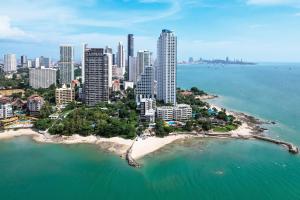 an aerial view of a city with a beach at Mayaana Beach Resort Pattaya - Formerly Golden Tulip Pattaya Beach Resort in North Pattaya