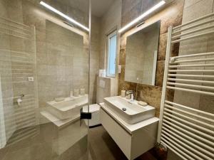 a bathroom with a sink and a mirror at Emma Casa Apartmant FREE Private Parking with EV supply availability in Budapest