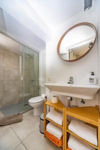 a bathroom with a sink and a shower at Luxury Beach La Concha Playa Honda in Playa Honda